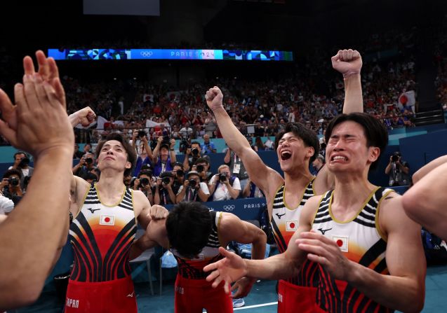 Japanese gymnasts celebrate after they won gold in the team competition on July 29. The Chinese team was in first place heading into the final rotation, but some costly mistakes on the horizontal bar dropped it to second place. The United States won the bronze.