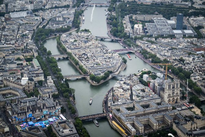 This aerial photo shows the Notre Dame cathedral as boats pass by on the Seine. As part of the opening ceremony, the bells of Notre Dame rang for the first time since the iconic cathedral was gutted by fire in 2019. It is 90% restored.