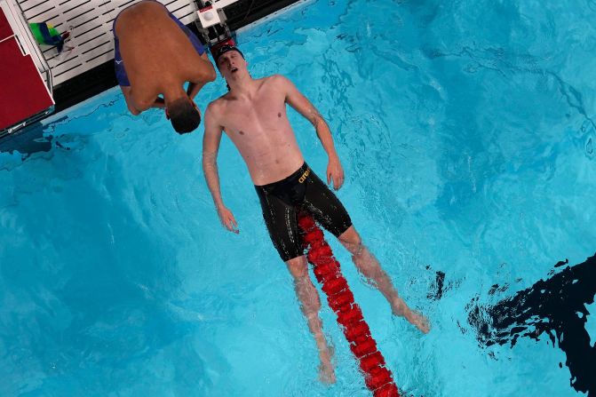 Germany's Lukas Maertens falls back on a lane rope after winning the 400-meter freestyle on July 27.