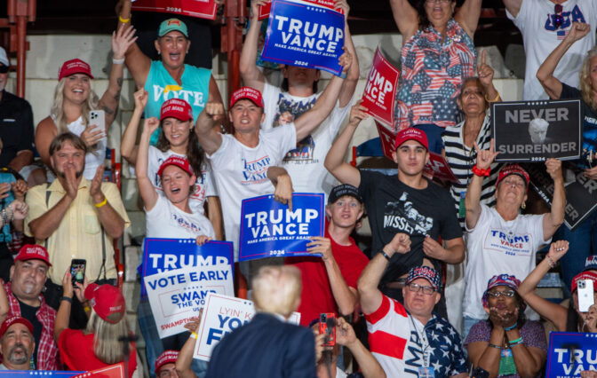 Donald Trump, bottom center, turns to recognize supporters during a rally in the New Holland Arena at the Pennsylvania Farm Show complex in Harrisburg Wednesday, July 31, 2024.