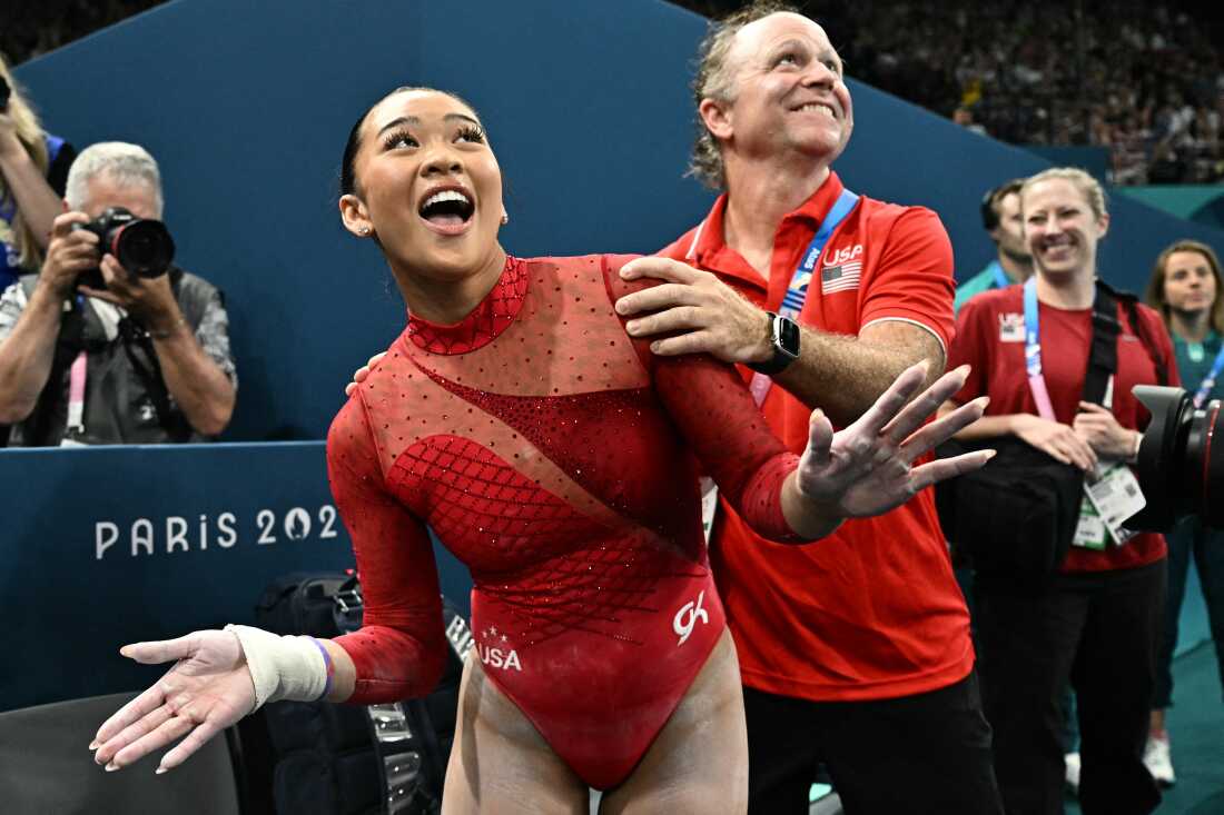 The USA's Sunisa Lee celebrates winning the bronze medal at the end of the women's uneven bars final Sunday. It was her third medal of the Games and sixth Olympic medal overall.