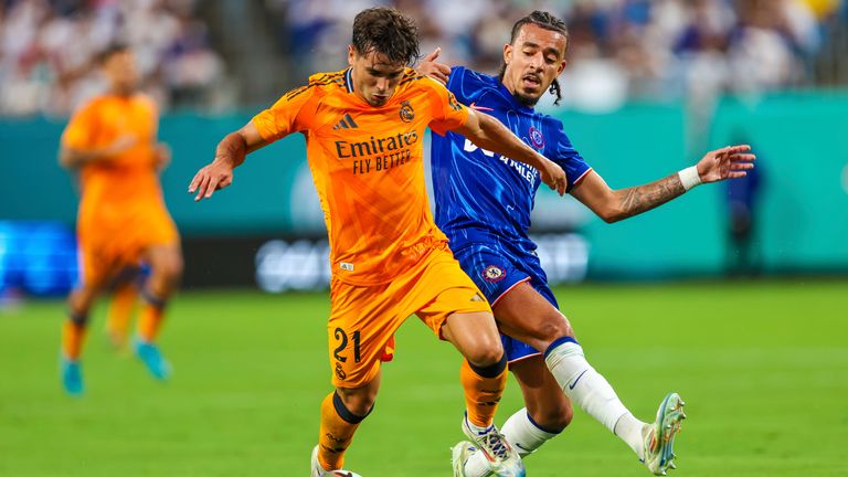 CHARLOTTE, NC - AUGUST 06: Brahim D..az #21 of Real Madrid and Malo Gusto #27 of Chelsea fight for control of the ball during the DIRECTV Soccer Champions Tour at Bank of America Stadium on Aug 6, 2024 in Charlotte, NC. (Photo by David Jensen/Icon Sportswire) (Icon Sportswire via AP Images)