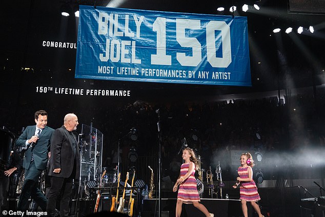 It turned out to be a family affair for the singer as his daughters were brought out on stage by family friend Jimmy Fallon to help unveil a banner honouring him for his history-making show