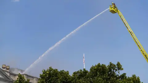 Reuters Firefighters work at the scene of a fire at Somerset House in London