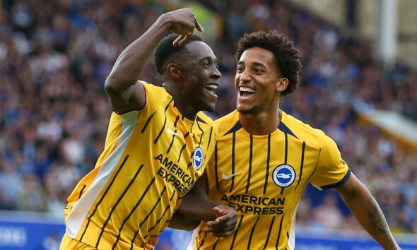 Danny Welbeck celebrates scoring Brighton's second goal with Joao Pedro