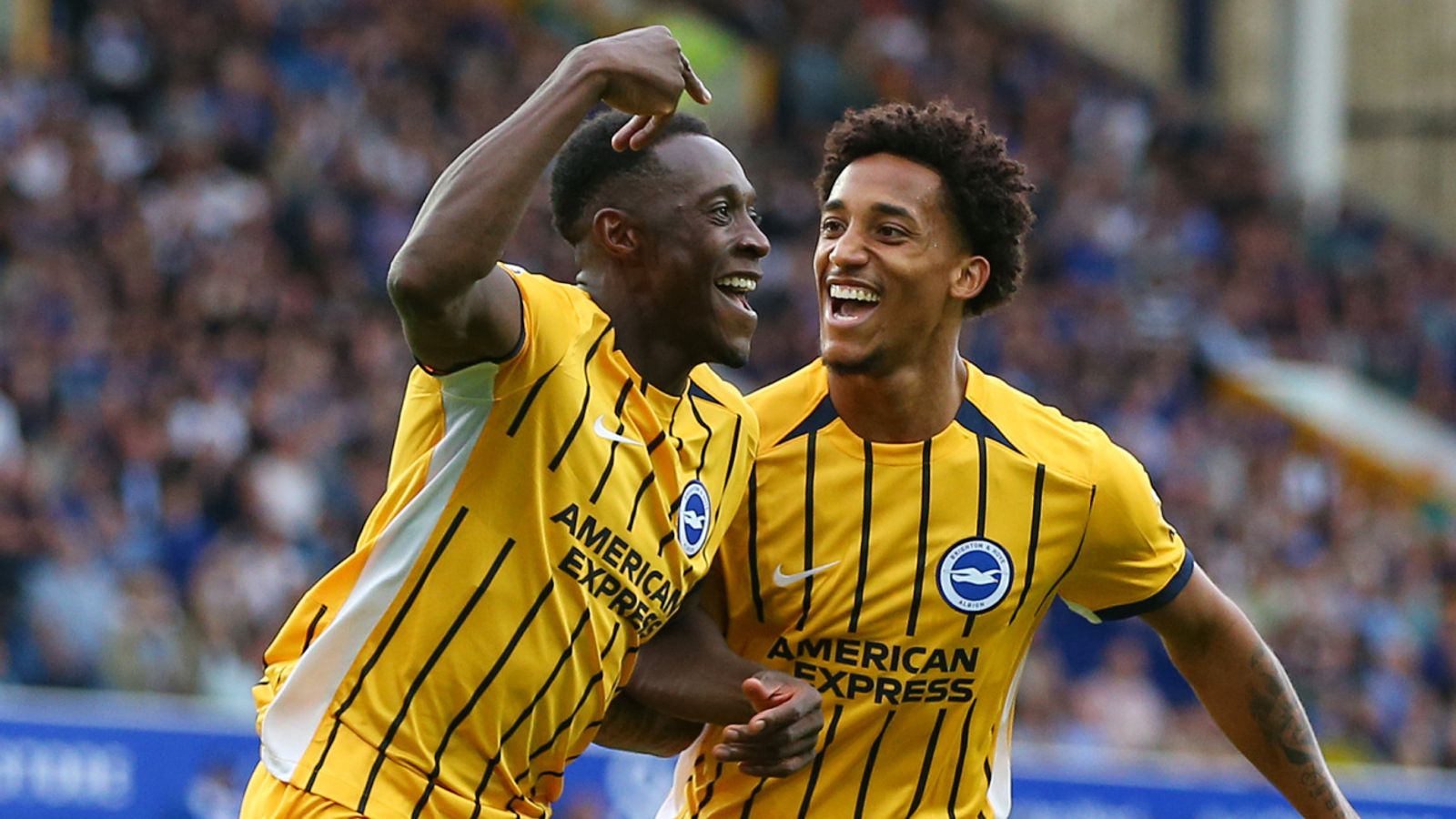 Danny Welbeck celebrates scoring Brighton's second goal with Joao Pedro