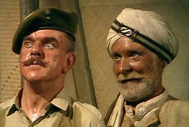 The BBC has reportedly deemed classic sitcom It Ain't Half Hot Mum too racist to ever air again. But the show has received support from British-Indian comedian Sanjeev Bhaskar (Above Windsor Davies, left, and Michael Bates in the TV series)