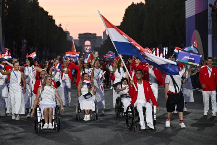 Croatia arrives to the Parade of Nations as the sun sets with the Arc de Triomphe in the background