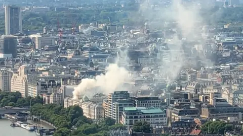 Getty Images  Smoke is seen rising from Somerset House, where a large fire has broken out on 17 August in central London