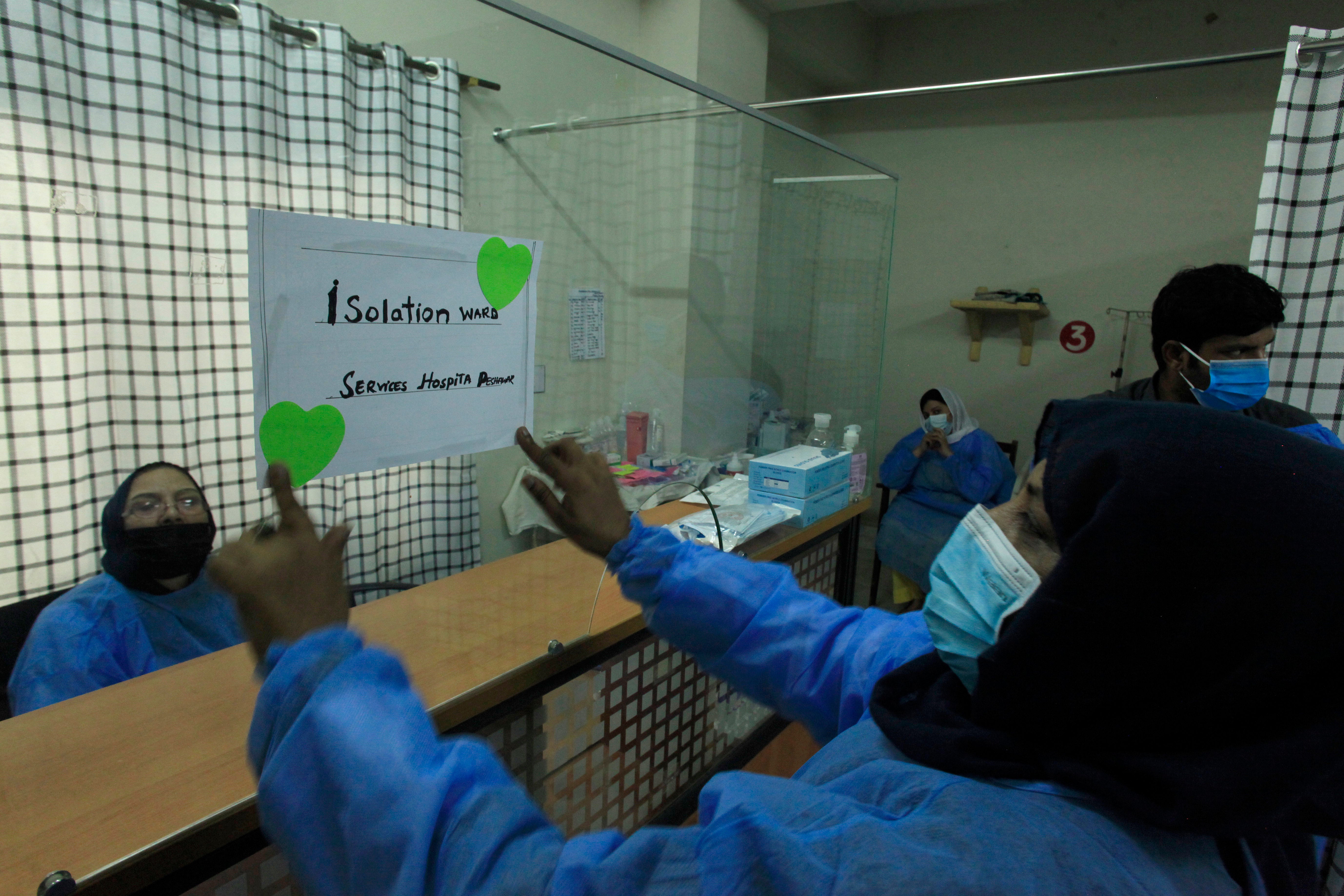 Paramedical staff prepare an isolation ward set up as a preventative measure following Pakistan's health ministry has confirmed a case of mpox in the Khyber Pakhtunkhwa province, at a hospital in Peshawar