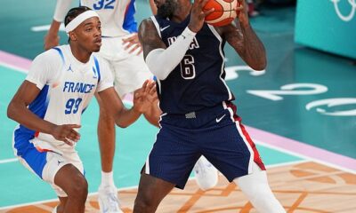 LeBron James (right) wore gold trainers during Team USA's Olympic final against France