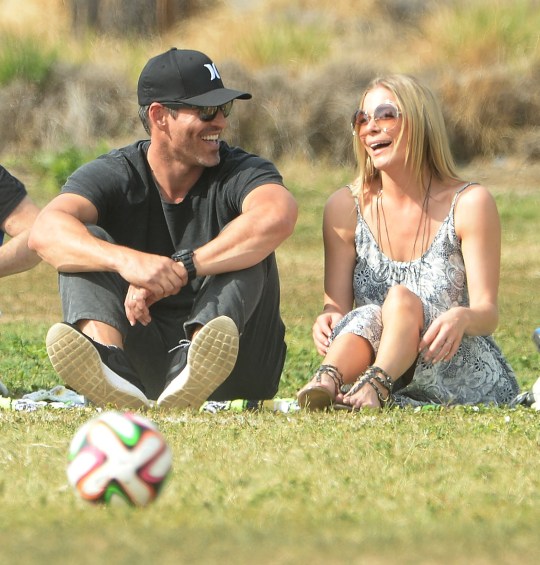 Eddie Cibrian and LeAnn Rimes watching a football game in 2015.