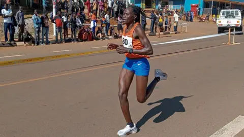 AP Rebecca Cheptegei, competes at the Discovery 10km road race in Kapchorwa, Uganda - 20 January 2023