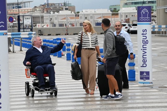 Eamonn Holmes sticking a thumbs up at Katie alexander outside Barcelona Airport