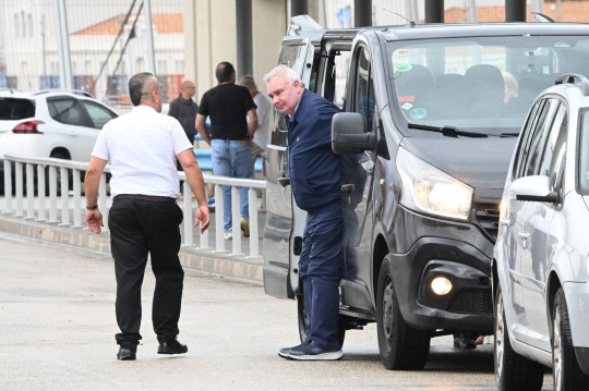 Eamonn Holmes getting out of a car at Barcelone Airport