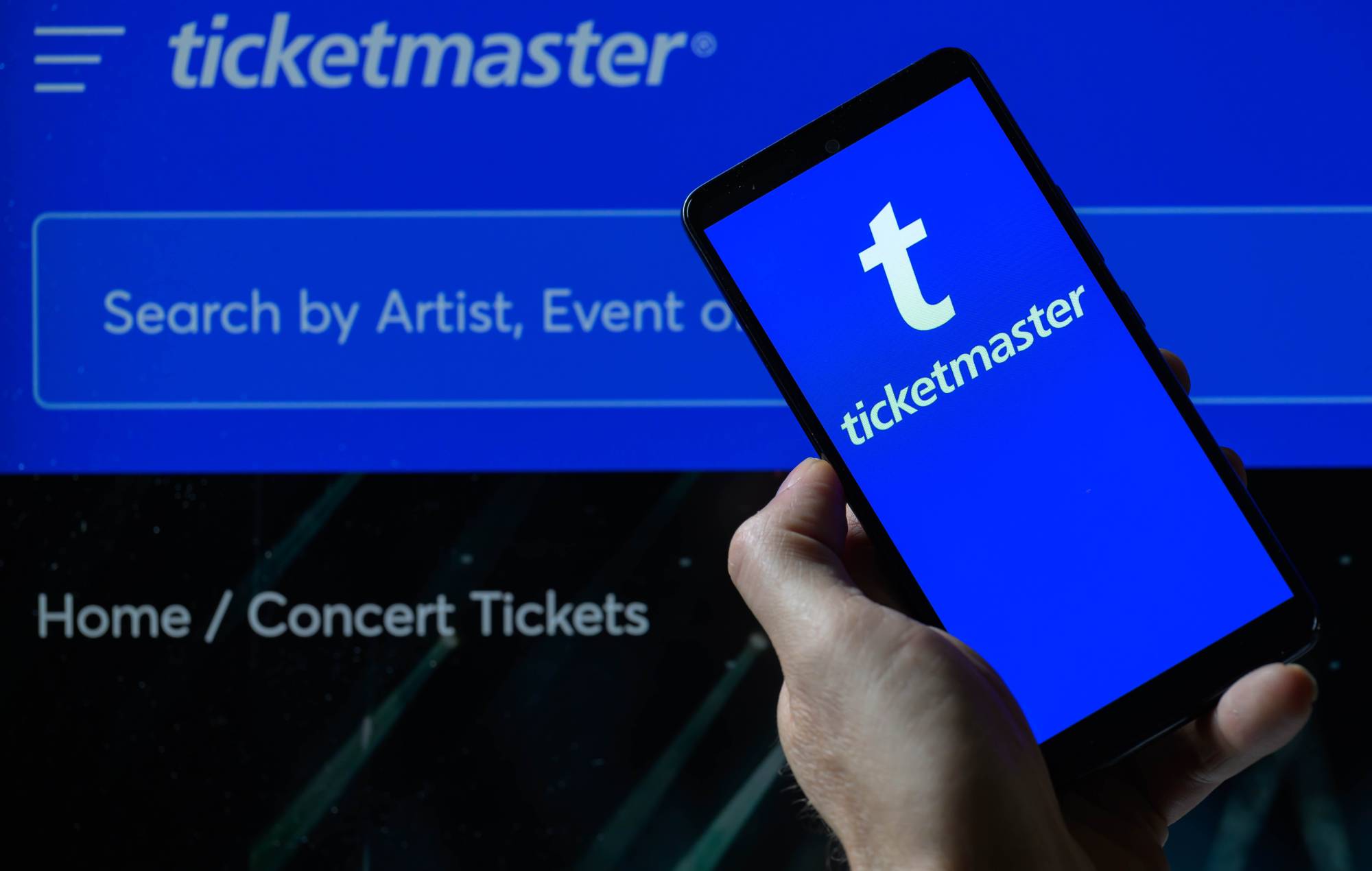 The Ticketmaster logo is being displayed on a smartphone with the Ticketmaster web home page. (Photo by Jonathan Raa/NurPhoto via Getty Images)