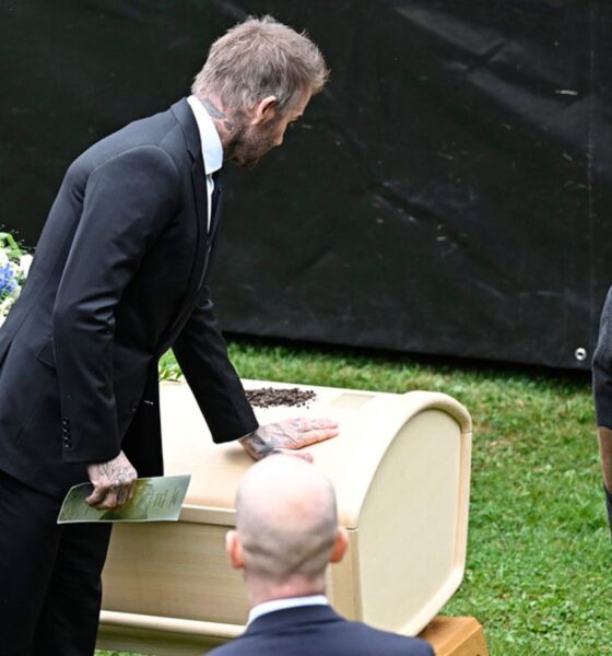 David Beckham touches Eriksson's coffin at the wake in Torsby. Pic: AP