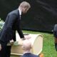 David Beckham touches Eriksson's coffin at the wake in Torsby. Pic: AP