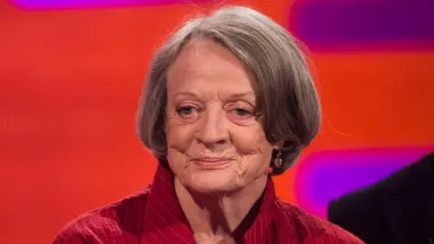 PA Dame Maggie Smith in a red jacket in 2015