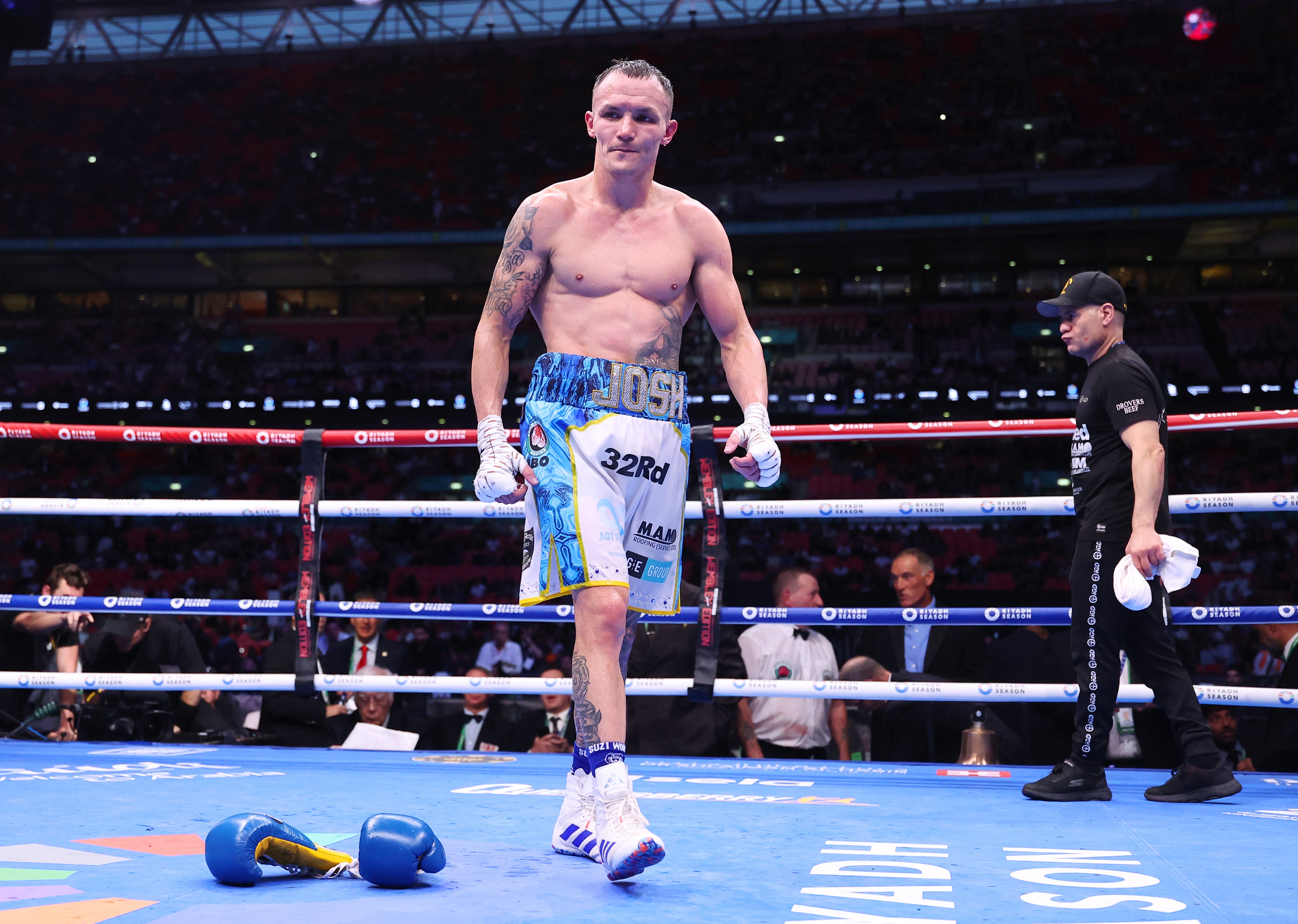 Josh Warrington walks out of the ring after throwing his gloves down