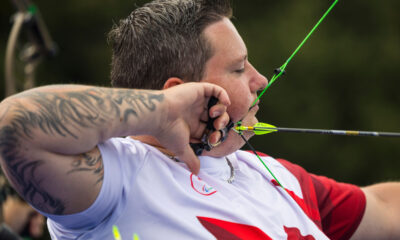 Kyle Tremblay pulls back an arrow preparing to shoot