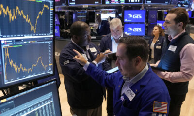 Wall Street soars to records as Dow leaps 500 in a rate-cut rally that swept the world