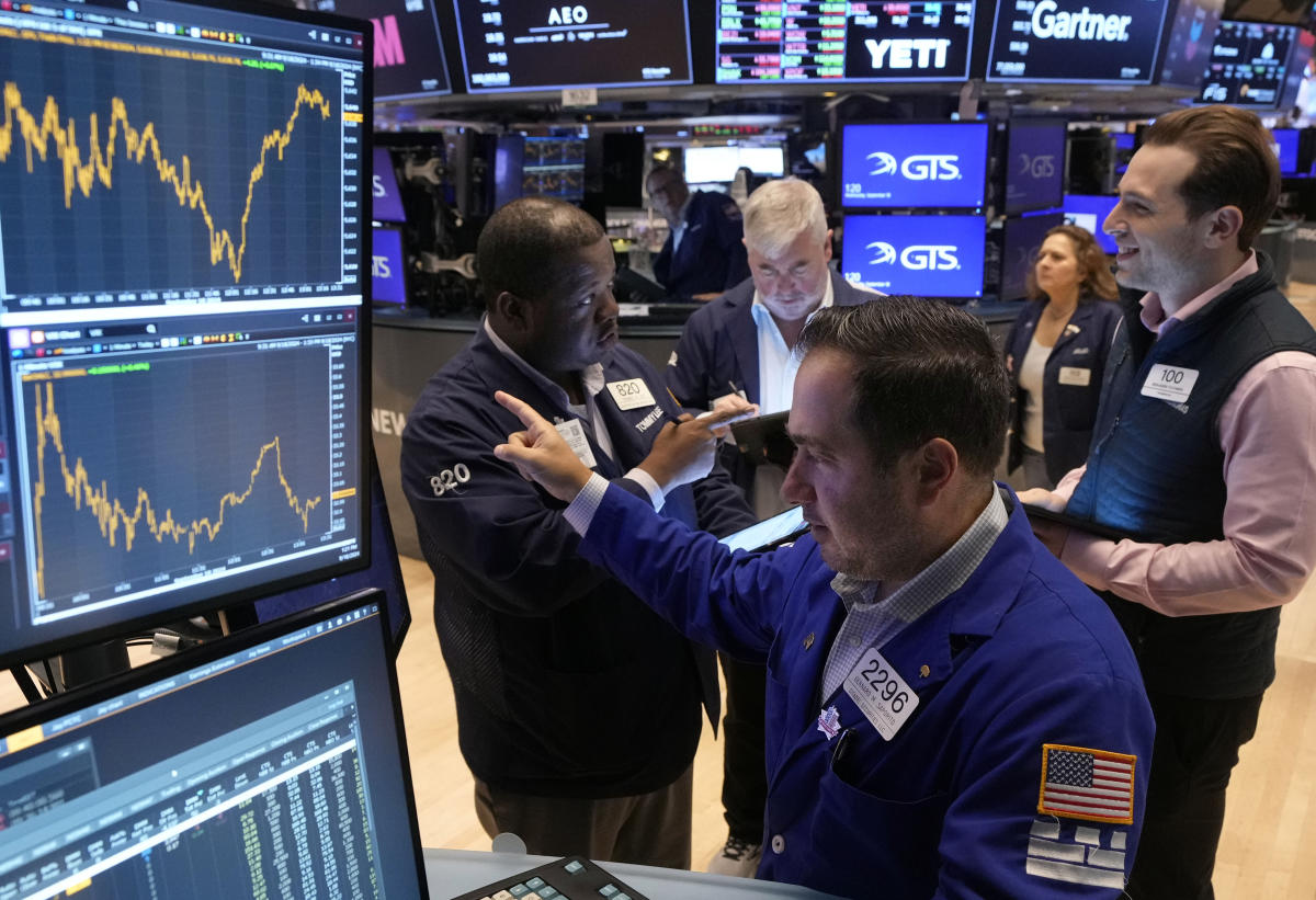 Wall Street soars to records as Dow leaps 500 in a rate-cut rally that swept the world