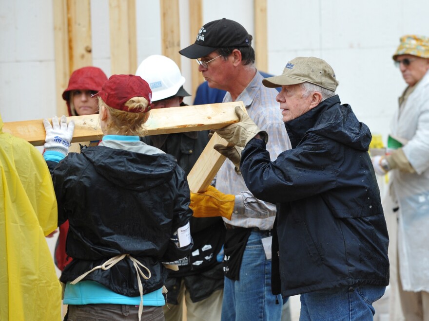 Carter takes part in a Habitat for Humanity project in October 2010 in Washington, D.C.