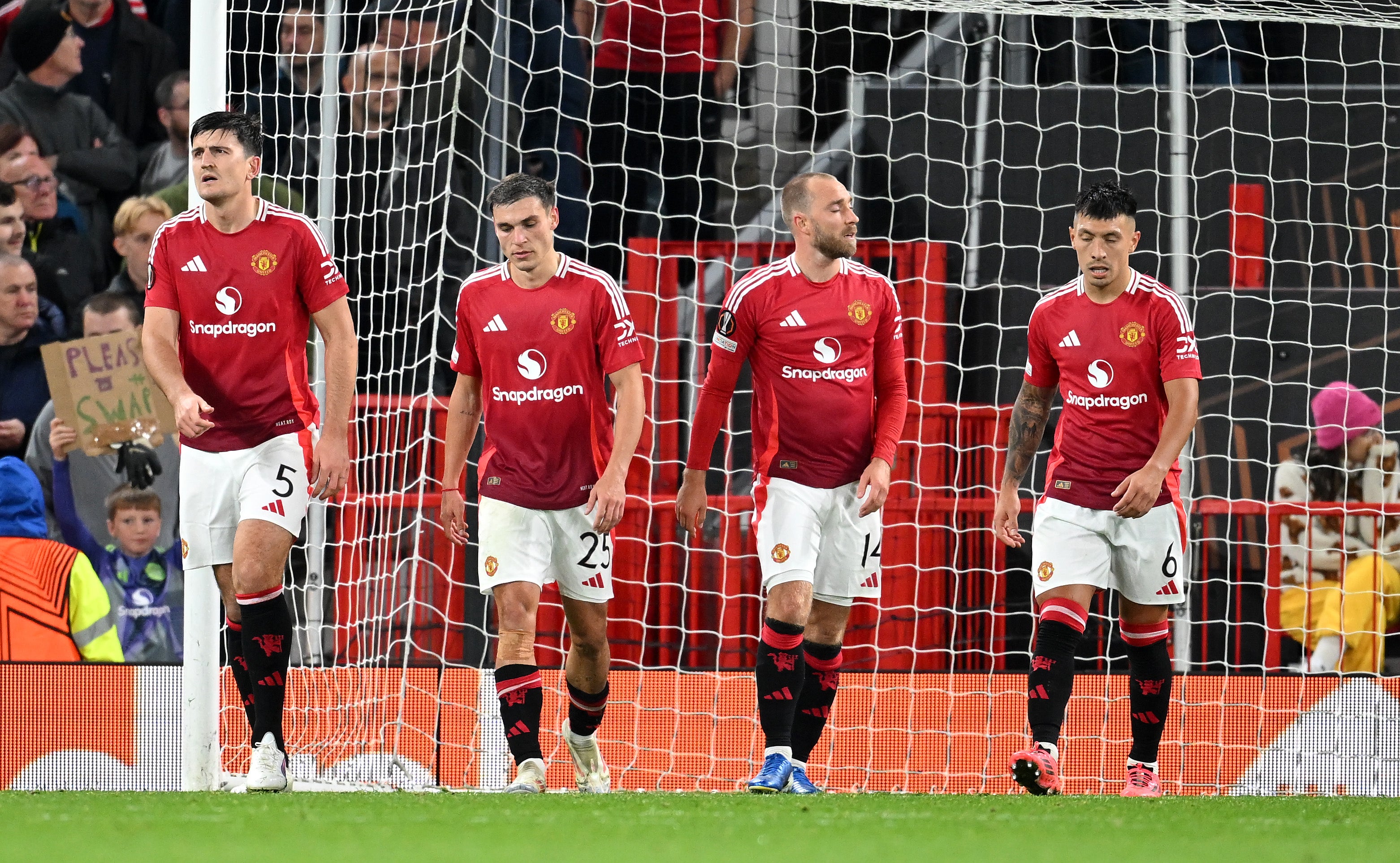 Harry Maguire, Manuel Ugarte, Christian Eriksen and Lisandro Martinez of Manchester United look dejected