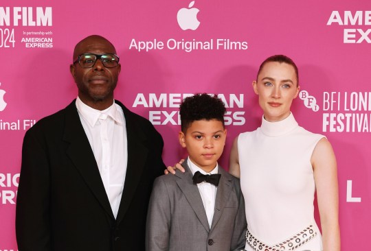 Sir Steve McQueen, Elliott Heffernan and Saoirse Ronan in black tie