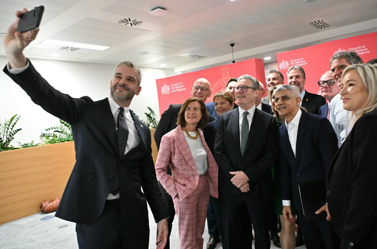 EDINBURGH, SCOTLAND - OCTOBER 11: South Yorkshire Mayor Oliver Coppard takes a selfie photograph with Britain's Prime Minister Keir Starmer (C), Wales' First Minister Eluned Morgan, Scotland's First Minister John Swinney Northern Ireland's First Minister Michelle O'Neill and other regional Mayors during the first Council of Nations and Regions, at Queen Elizabeth House on October 11, 2024 in Edinburgh, Scotland. Britain's Prime Minister Keir Starmer is convening the first meeting of the Council of Nations and Regions in Edinburgh, Scotland. The council will focus on maximizing opportunities to deliver investment and growth, with the aim of boosting living standards across the UK. Those in attendance will include First ministers, Northern Ireland's First Minister and Deputy First Minister, as well as regional mayors from across England. (Photo by Andy Buchanan-WPA Pool/Getty Images)