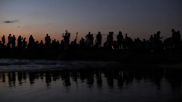 People gather to observe the launch of SpaceX's Starship