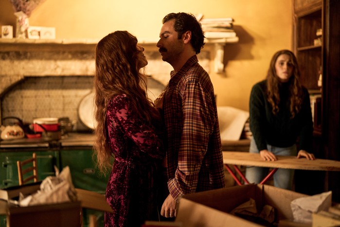 Victoria Smurfit as Maud and Aidan Turner as Declan O'Hara in Rivals embracing in the middle of their kitchen.