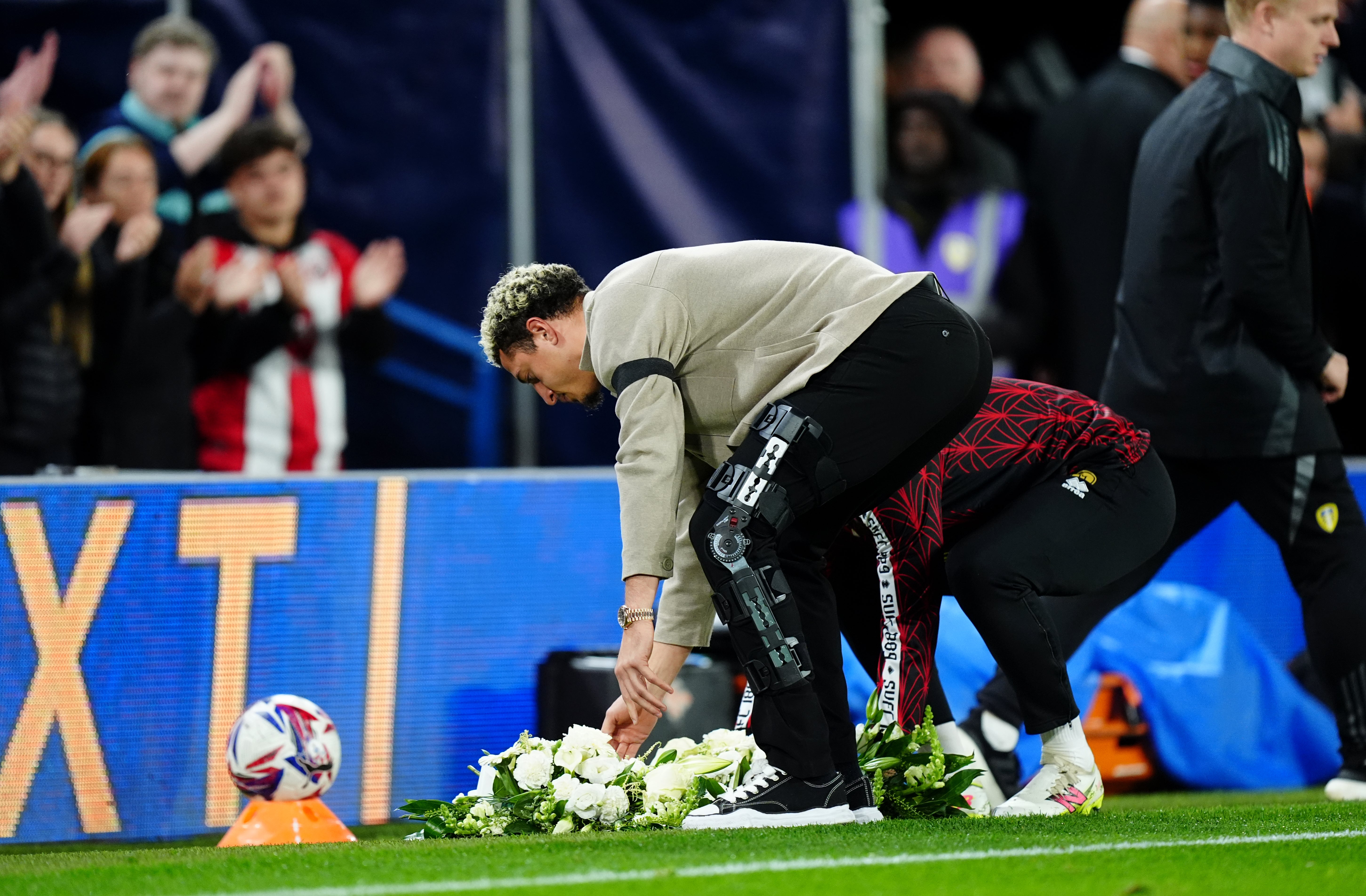 Leeds captain Ethan Ampadu laid a wreath in tribute to Baldock