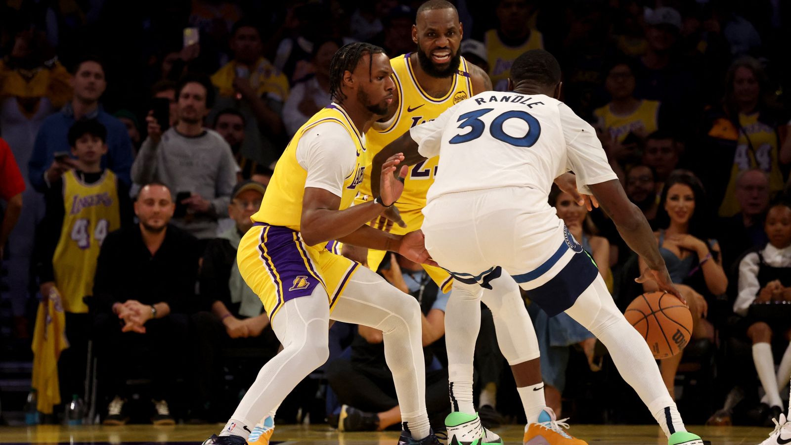 LeBron (middle) and his son (left) fulfilled a long-held ambition. Pic: Reuters