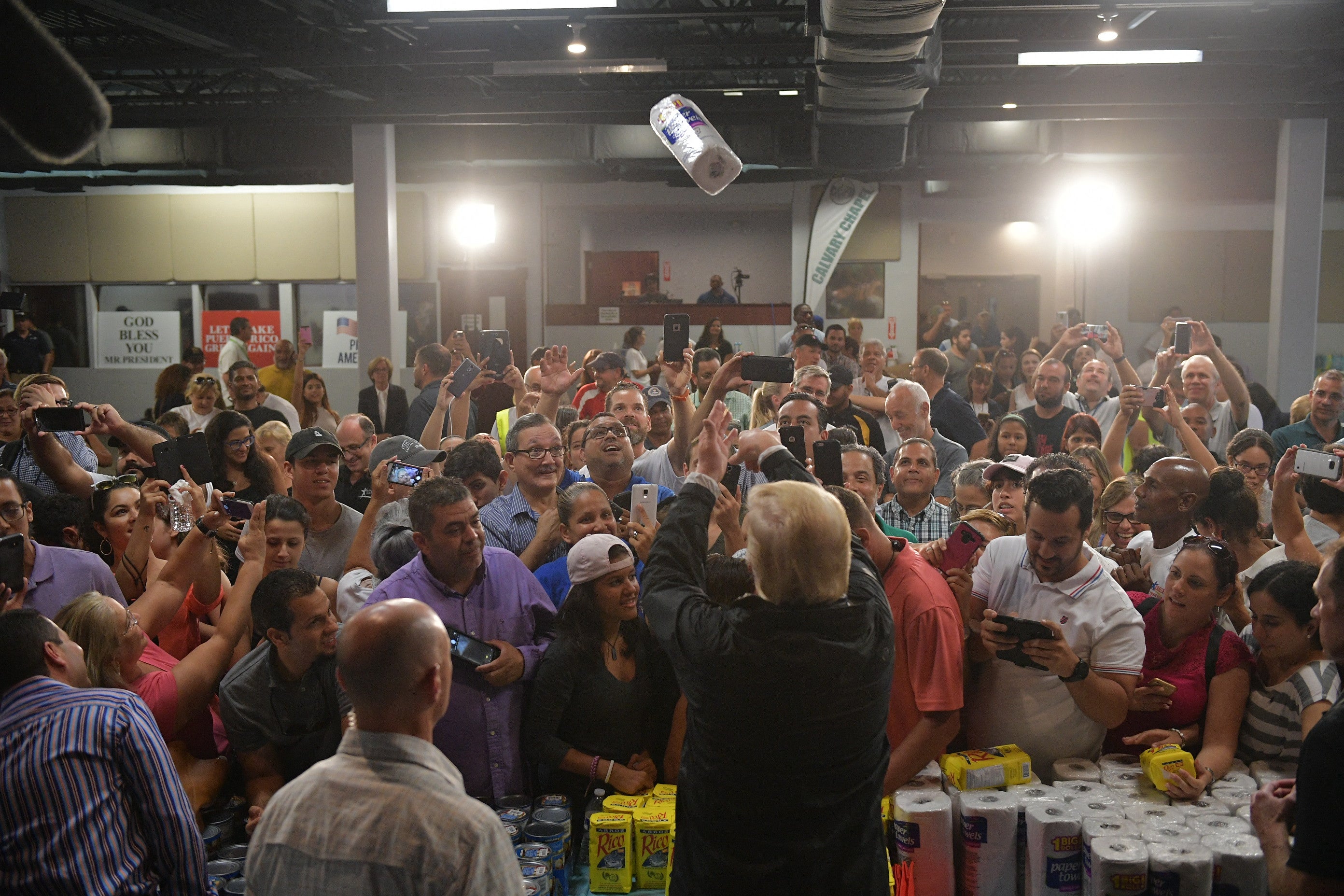 Then-president Donald Trump throws a paper towel roll during a visit to Guaynabo, Puerto Rico in 2017, in the aftermath of a devastating hurricane