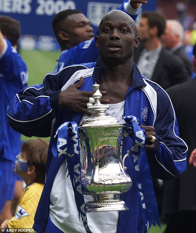 Weah pictured with the FA Cup trophy in 2000 after playing in Chelsea's victory in the final