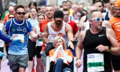 Colin Farrell finishes marathon while pushing friend in wheelchair