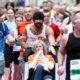 Colin Farrell finishes marathon while pushing friend in wheelchair