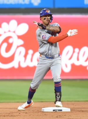 New York Mets third baseman Mark Vientos (27) reacts after driving in the tying run against the Philadelphia Phillies in the eighth inning in Game 1 of the NLDS at Citizens Bank Park.