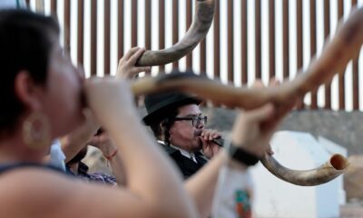 Yehojanan Skarbnik from Torreon, Coahuila, Mexico blows his Shofar Wednesday, Sept. 16, 2020, to start the two days of Rosh Hashanah, the Jewish new year. A small group from Mexico met up with their US counterparts at International Boundary No. 1 at the intersection of Texas, New Mexico and Chihuahua to sing and blow the shofar.