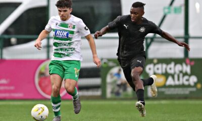 OSWESTRY, SHROPSHIRE, ENGLAND - 13th AUGUST 2024 - TNS' Ben Clark is pressured by Petrocub's Donalio Dounala during The New Saints vs Club Sportiv Petrocub Hincesti in the UEFA Europa League Third qualifying round second leg at Park Hall, Oswestry