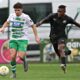 OSWESTRY, SHROPSHIRE, ENGLAND - 13th AUGUST 2024 - TNS' Ben Clark is pressured by Petrocub's Donalio Dounala during The New Saints vs Club Sportiv Petrocub Hincesti in the UEFA Europa League Third qualifying round second leg at Park Hall, Oswestry