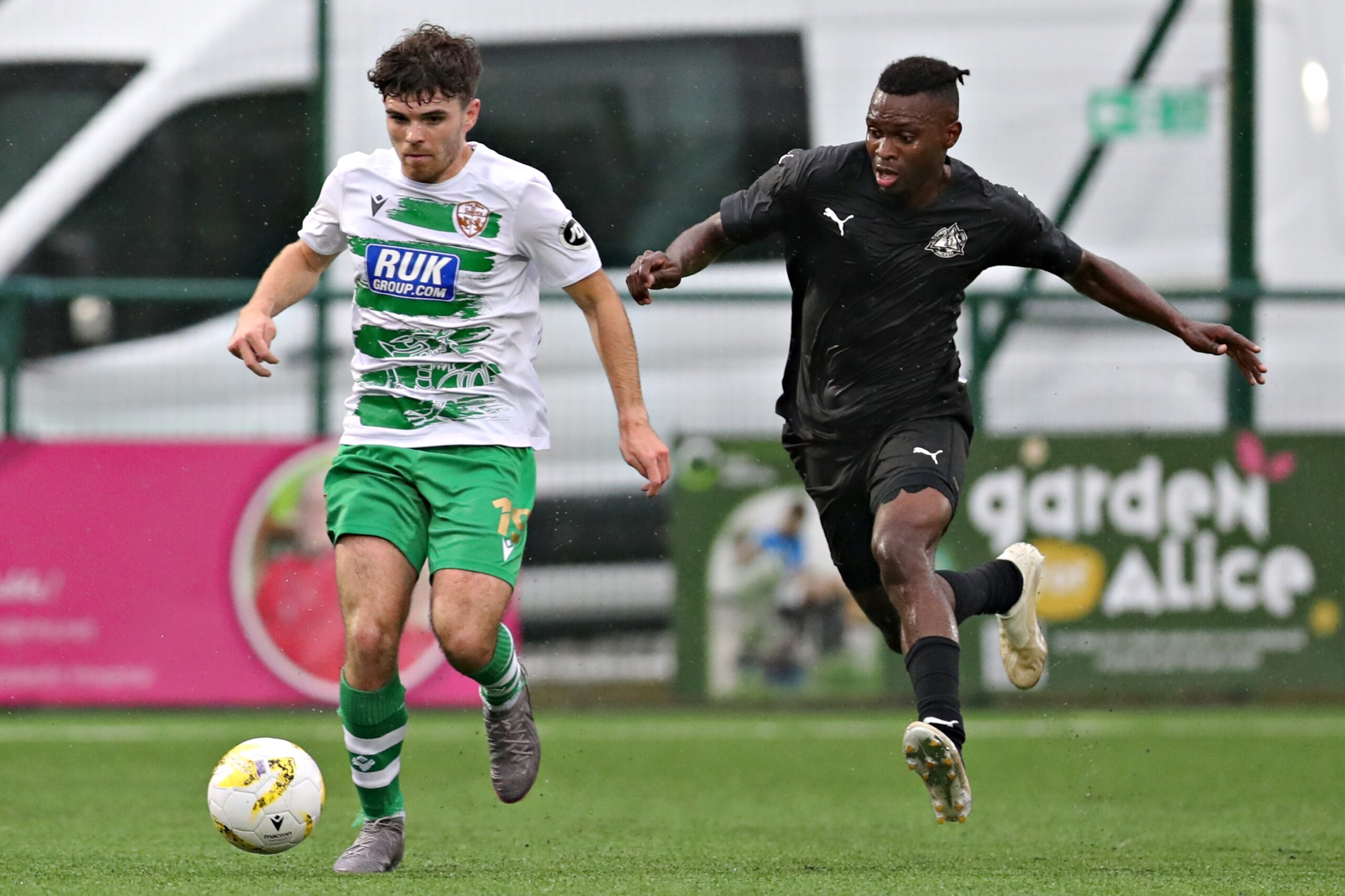 OSWESTRY, SHROPSHIRE, ENGLAND - 13th AUGUST 2024 - TNS' Ben Clark is pressured by Petrocub's Donalio Dounala during The New Saints vs Club Sportiv Petrocub Hincesti in the UEFA Europa League Third qualifying round second leg at Park Hall, Oswestry