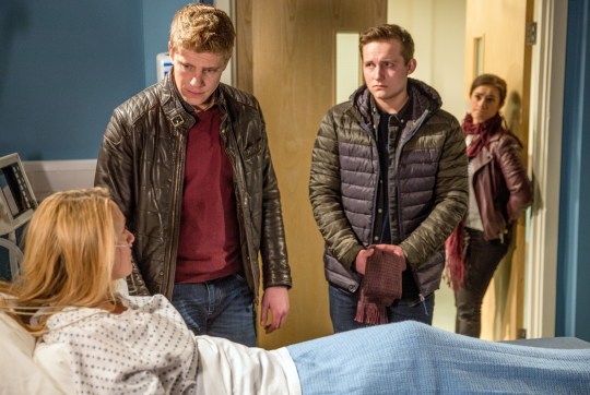 Robert and Lachlan visit Rebecca White, who lies in a hospital bed in Emmerdale