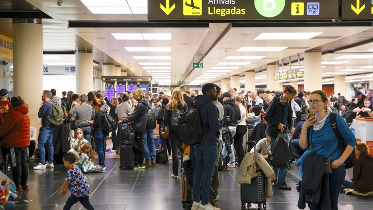 Several people at Barcelona-El Prat airport as flights are diverted due to the weather.
Pic: Europa Press/AP