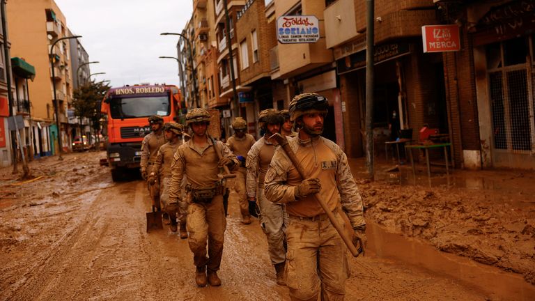 Members of the Spanish military prepare to help residents, in the aftermath of floods caused by heavy rains, in Massanassa, near Valencia, Spain, November 3, 2024. REUTERS/Susana Vera