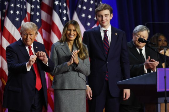 Donald Trump clapping with Melania Trump and Barron Trump during 2024 US election 