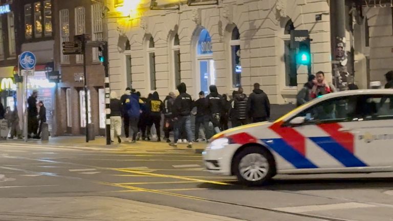 Israeli football supporters and Dutch youth clash near Amsterdam Central station, in Amsterdam, Netherlands, November 8, 2024, in this still image obtained from a social media video. Pic: Reuters/X/iAnnet