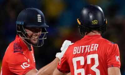 England's captain Jos Buttler and Will Jacks celebrate runs against West Indies during the second T20 cricket match at Kensington Oval in Bridgetown, Barbados, Sunday, Nov. 10, 2024. (AP Photo/Ricardo Mazalan)